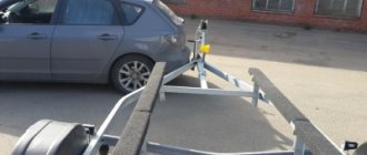 The trailer drawbar is attached to the car bumper